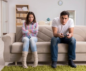 Young family suffering from computer games addiction