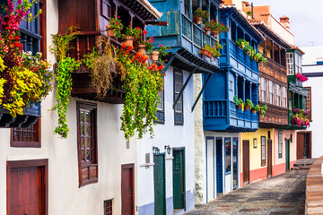 Beautiful colorful floral streets with traditional balconies of Santa Cruz de la Palma - capital of La Palma island, Canary islands of Spain - obrazy, fototapety, plakaty