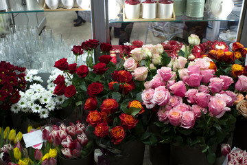 multi-colored roses and tulips in a department store, fresh flowers sales department
