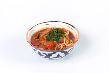 Noodle soup with meat on a white plate for menu and web