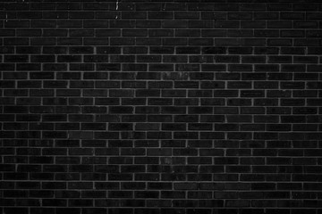Fototapeta na wymiar Old black and white brick wall background texture.