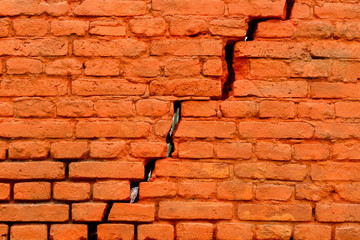 Obraz premium Old Weathered Cracked Orange Painted Brick Wall Texture