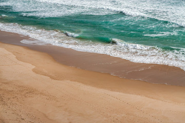 Fototapeta na wymiar Scenic view of golden sand and surf on Australian beach