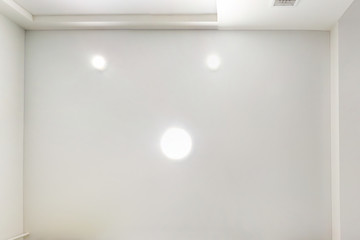 suspended ceiling with led lightspot lamps and drywall construction in empty room in apartment or...