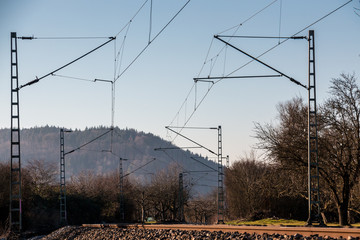 Power lines and rails along the countryside ready for transport