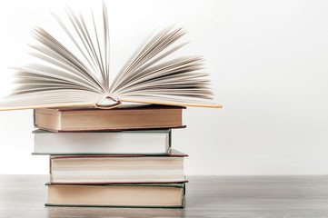 An open book on a stack of books. The concept of education , international book day, success.