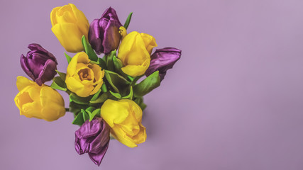 bouquet of yellow and purple tulips top view. banner with tulips. spring background with flowers.