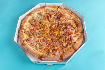 Pizza on the table in light blue color
