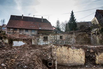 Bombed and destroyed houses with a lot of debris everywhere