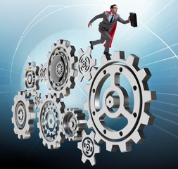 Businessman in teamwork concept with cogwheels