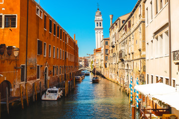 A nice canal with tourists sailing from Venice. Italy