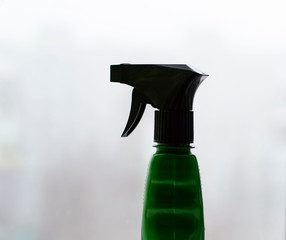 plastic bottle spray with detergent for windows.