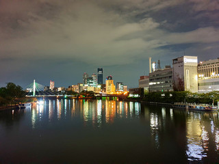 Fototapeta na wymiar City reflection on the water at night
