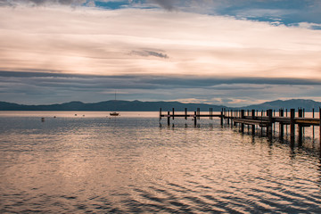 Sunset view of a sailboat and dock in Lake Tahoe, Homewood