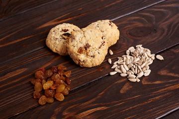 cookies with raisins and seeds on a brown background