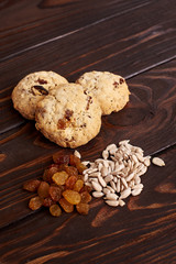 cookies with raisins and seeds on a brown background