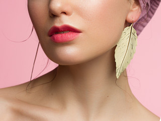 Close-up of woman's lips with bright fashion red glossy makeup. Macro bloody lipgloss make-up