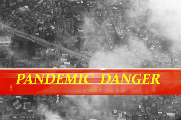 Pandemic danger written on red background. Black and white photo of aerial view of an european city. Global pandemic concept. Coronavirus concept.