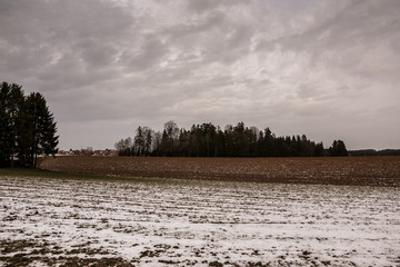 Plow land with ice and snow in the middle of winter