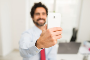 Businessman taking a selfie portrait