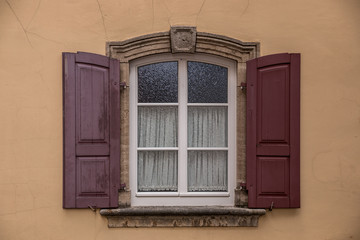 Old window of an old historical building of the town