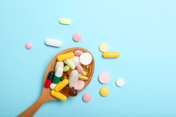 pills on a colored background top view. Medicine, treatment, illness. Medication in tablets.