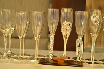 Champagne wedding glasses in a raw decorated in silver color 