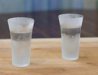 ice-cold vodka on a wooden counter. alcohol