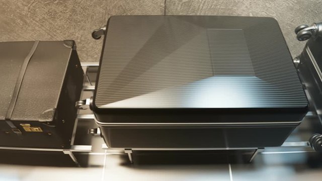 Black Suitcases and Bags on Airport Baggage Claim Conveyor Belt