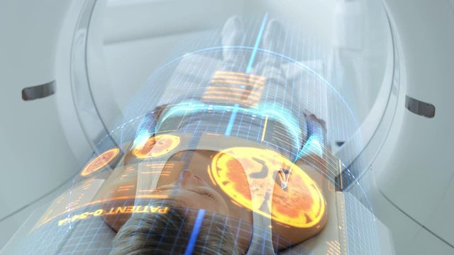 Female Patient Lying on CT or PET or MRI Scan Bed, Moving Inside the Machine While it Scans Her Brain and Vital Parameters. Augmented Reality Concept with VFX In Medical Lab with High-Tech Equipment.