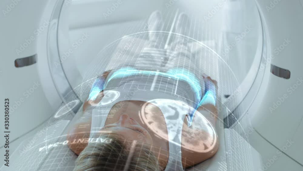 Leinwandbilder female patient lying on ct or pet or mri scan bed, moving inside the machine while it scans her brai