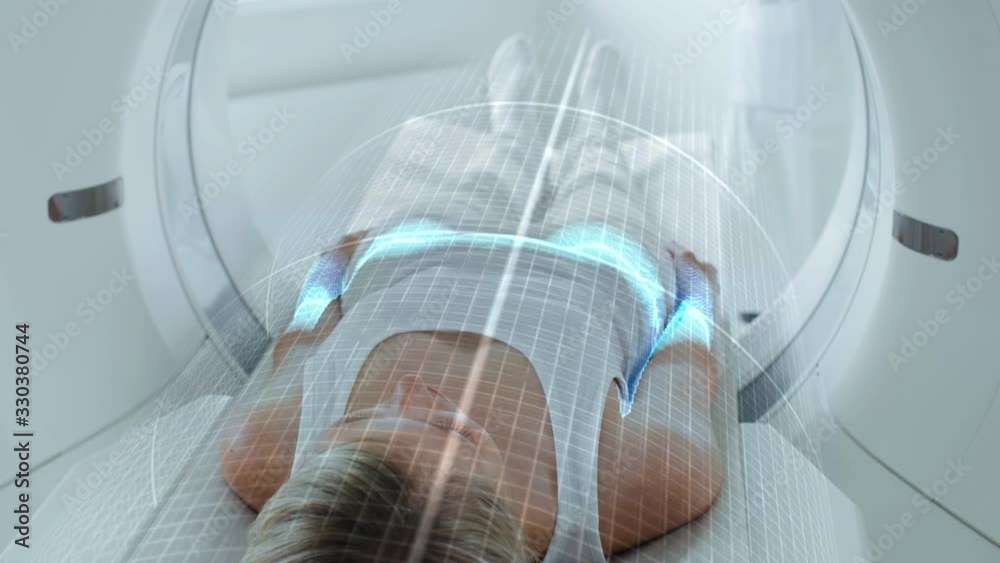 Aufkleber female patient lying on ct or pet or mri scan bed, moving inside the machine while it scans her brai