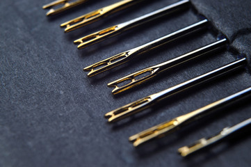 Set of sewing needles with carabiners, gold plated.