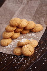 Lean cookies with coconut on a brown background