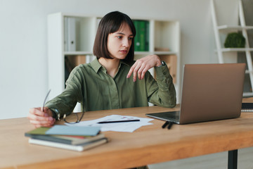 Frustrated brunette female freelancer has just got bad news
