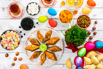 Colored Eggs, Wheat Springs for Easter and Traditional Sweets for Novruz Ramadan in Azerbaijan. Selective focus.