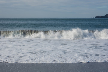 waves breaking on beach