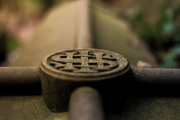 IHS Christianity Symbol meaning Jesus Christ on a stone grave