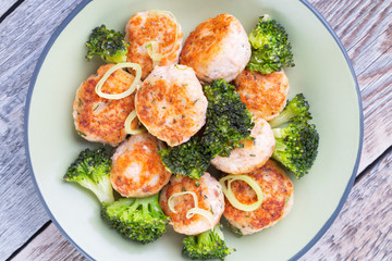 Plate of salmon meatballs with vegetables