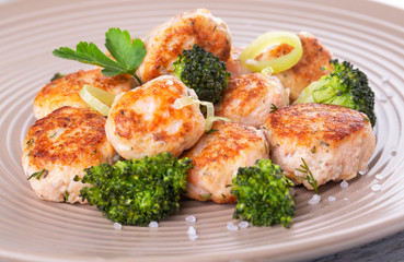 Plate of salmon meatballs with vegetables