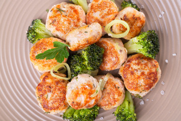 Plate of salmon meatballs with vegetables
