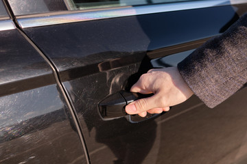 The man closed the car door while going out.