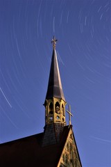 Bell tower and a star trails