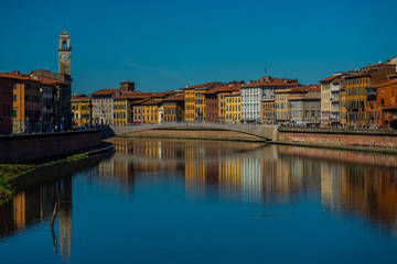 Pisa in Tuscany, view the river Arno with bridge in historical center