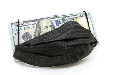 One hundred dollar bill with medical black face mask on face Benjamin Franklin.