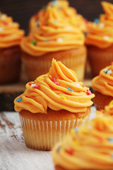 Cupcakes with orange icing on top