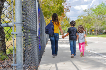 coronavirus kids school empty mom kids walk closeup fence exterior walk cough elbow abandoned trapped scary book walk in hold notebook empty young boy girl waiting ride home pickup covid19 © 99 Pages