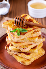 Traditional sweet fried toasts with honey and mint