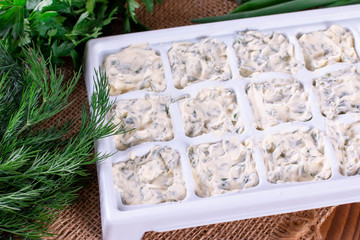 Frozen cubes of herbs with butter