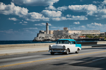 Retro car on the embankment of Havana